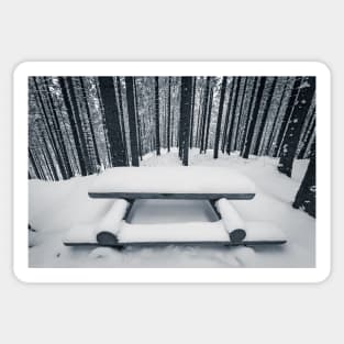 Wooden bench and table covered with snow among winter forest Sticker